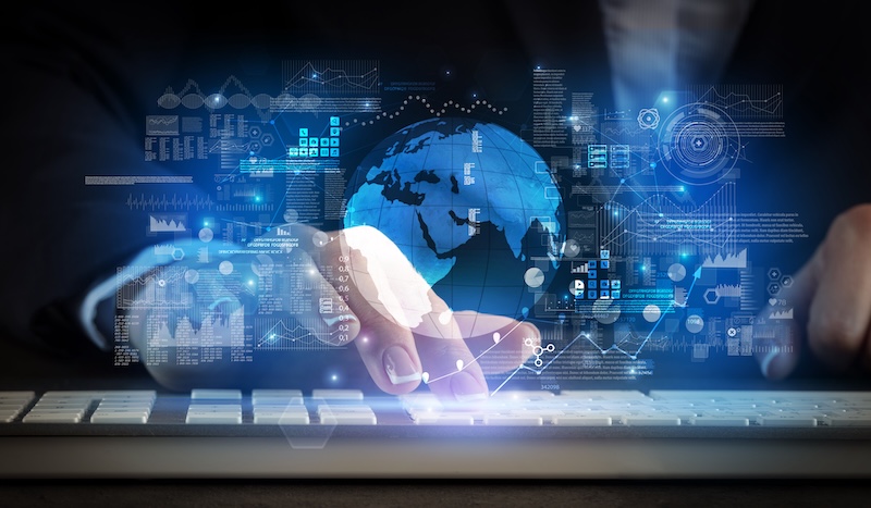 Business woman typing on keyboard with global system concept